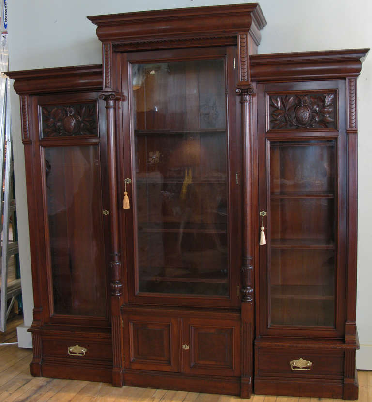 a very handsome antique 1850's Mahogany Glass fronted triple bookcase cabinet, beautifully restored, with magnificent hand carved owl & oak leaf motif