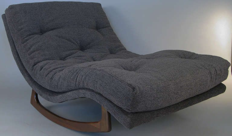 a very relaxing and comfortable double wide rocking chaise lounge c. 1965 designed by Adrian Pearsall for Craft Associates. Sculptural walnut base, and reupholstered in a soft grey textured fabric.