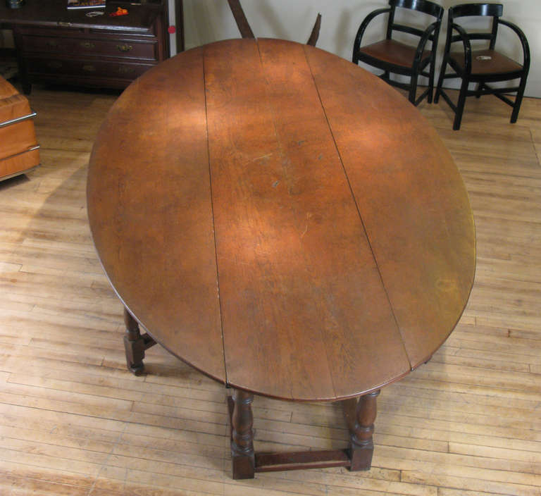 an impressive large oval drop leaf gate-leg table.