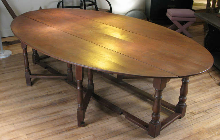 British Antique English Oak Drop Leaf Oval Table