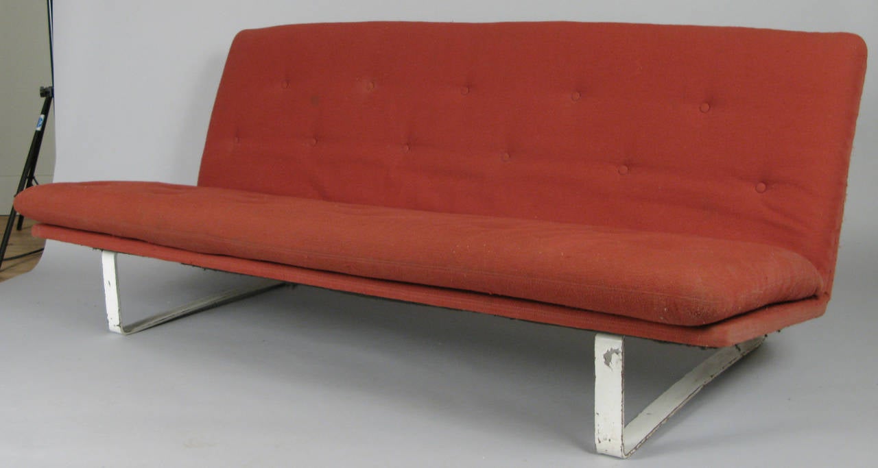 A Classic modern sofa designed by Kho Liang for Artifort, Holland in 1968. This example is in its original white frame with orange upholstery. Both the finish on the frame and the upholstery will need updating.