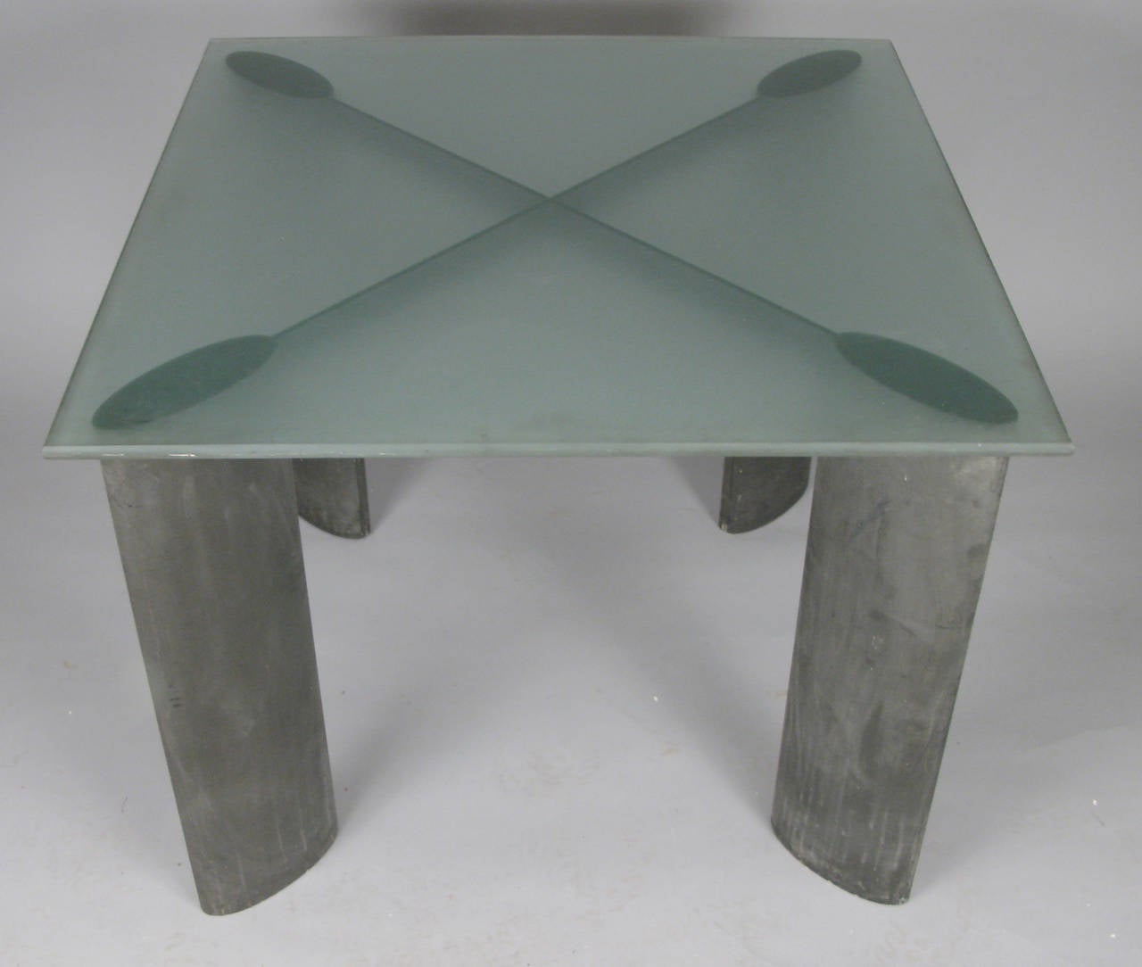 A modern 1980s table designed by architect Piotr Sierakowski for Koch & Lowy. Glass top is sandblasted on one side and polished on the other, with sandblasted edges. extruded aluminum base in its original dark grey finish.