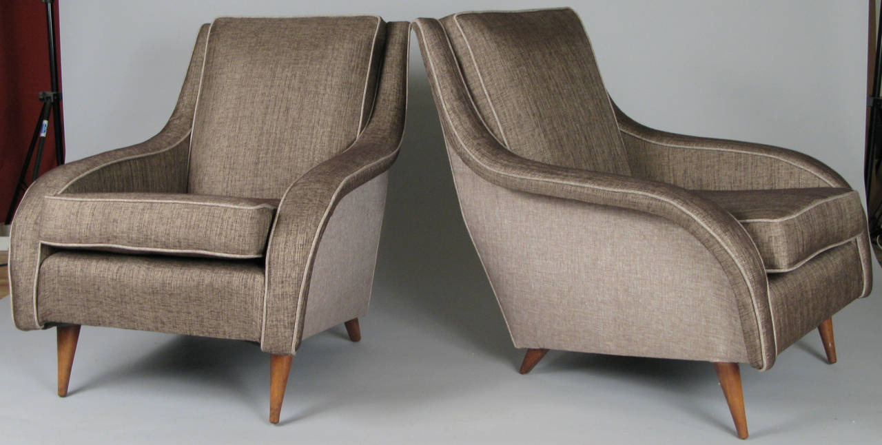 A very handsome pair of vintage 1950s Italian lounge chairs in the style of Carlo de Carli. Beautiful lines and very comfortable, freshly reupholstered in a combination of bronze and pale grey fabrics.