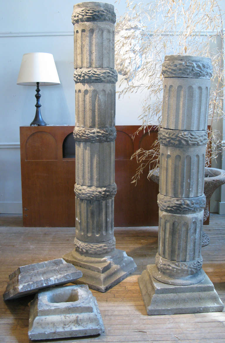 A very interesting collection of garden columns, made of cast stone, in sections of columns and wreath spacers, with bases and capitols. Includes 7 column sections and 9 wreath spacers, along with 2 bases and 2 capitols. 

each column section is