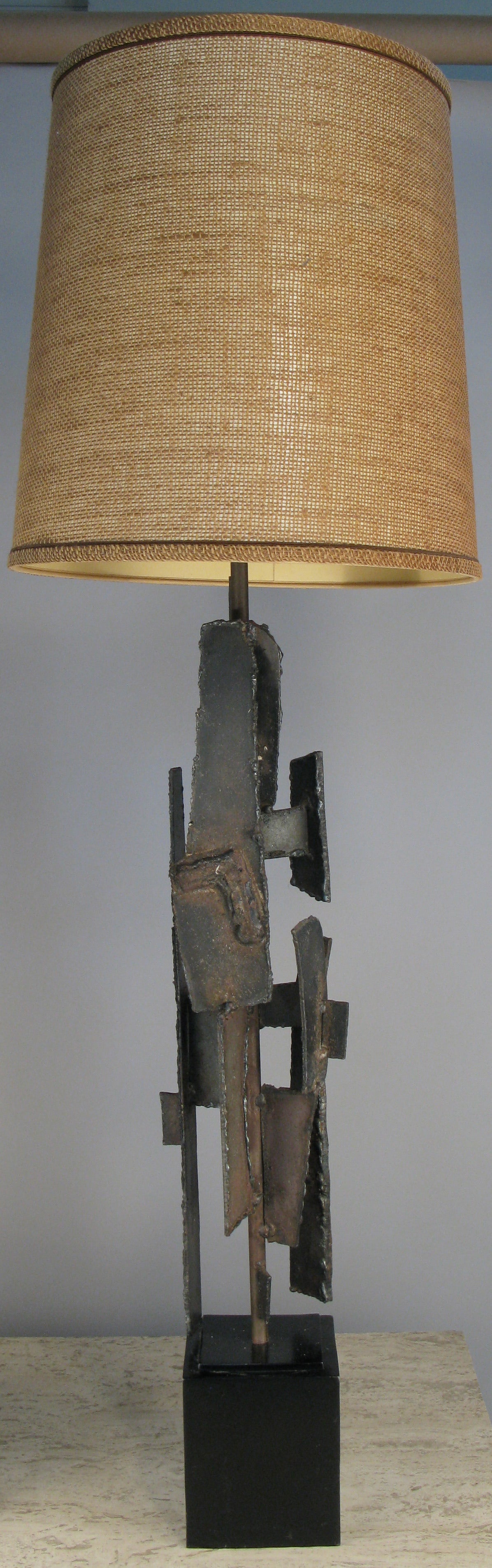 A pair of vintage 1960s Brutalist iron and torch cut steel lamps by Harry Balmer.