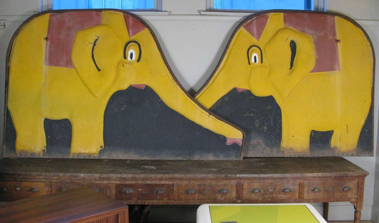 a pair of vintage steel elephants in original finish. these were the right and left sides to a 1950's children's slide, and would be great decorative elements used either as a pair or individually.