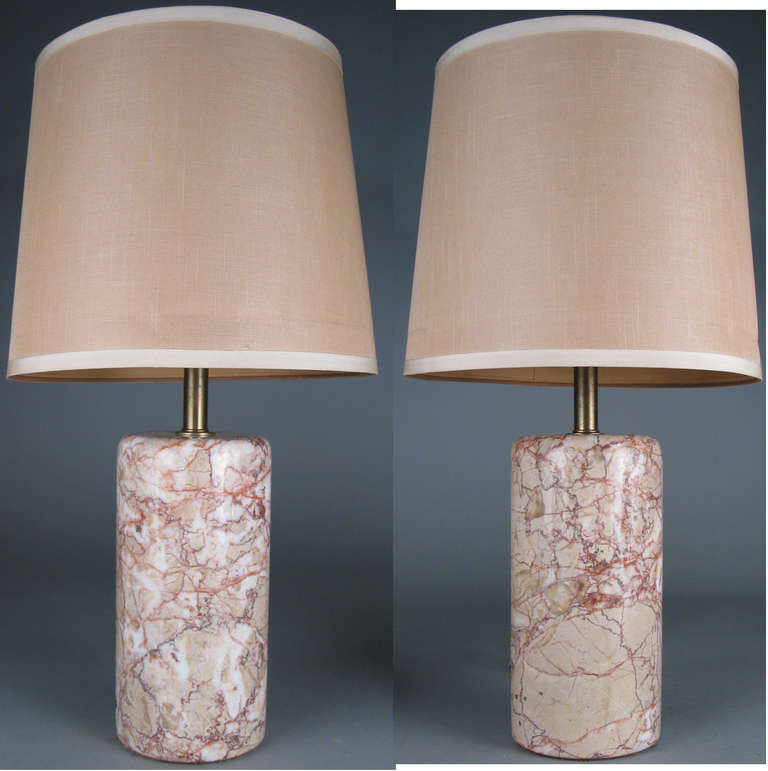 a beautiful pair of 1960's Italian marble lamps, in cylinder form, with polished edges. gorgeous very pale pink marble with darker veins. shades not included.