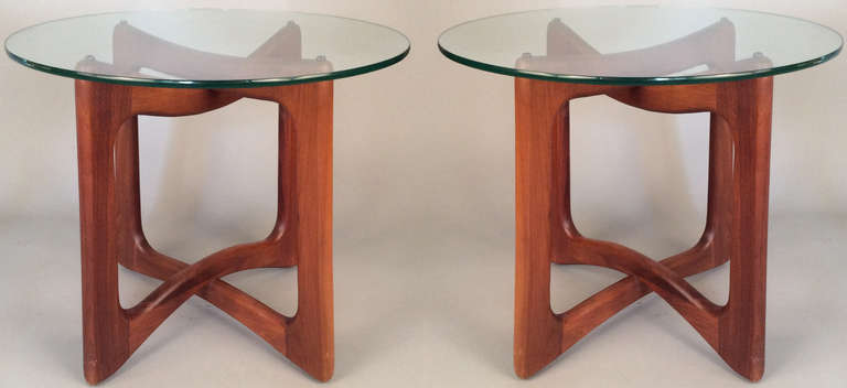 a beautiful pair of vintage 1960's modern tables designed by Adrian Pearsall for Craft Associates. bases formed with interlocking open forms in sculpted walnut with round glass tops. engaging design and impeccable craftsmanship.