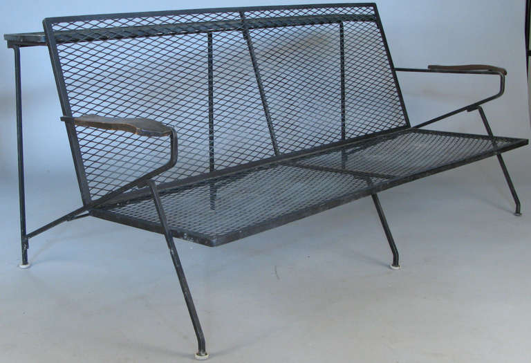 a very rare 1950's sette designed by Maurizio Tempestini for Salterini, incorporating a high iron mesh shelf in the back, with the original Italian marble.  from the estate of a Salterini employee, we also have the companion pair of matching lounge