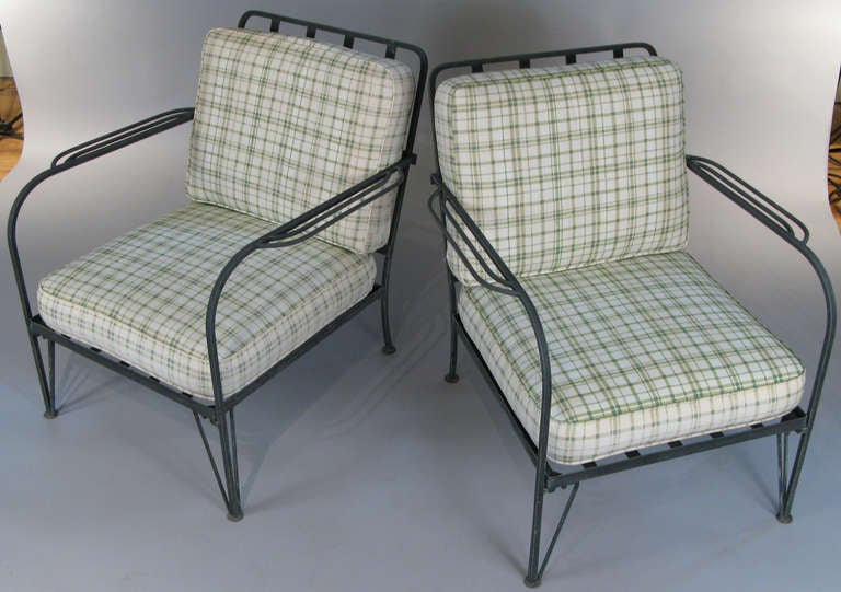a very nice pair of 1950's iron lounge chairs by Salterini. very nice subtle details and very well made with beautiful patina and original cushions. 