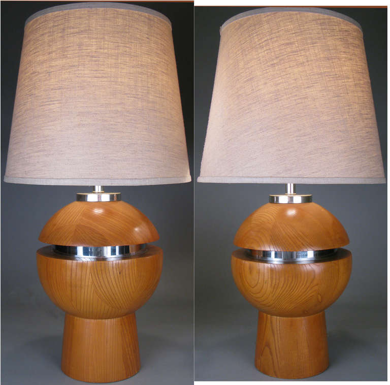 An outstanding pair of large vintage 1970s modern table lamps with bases of stacked oak with chrome center. Very well made, fantastic design.