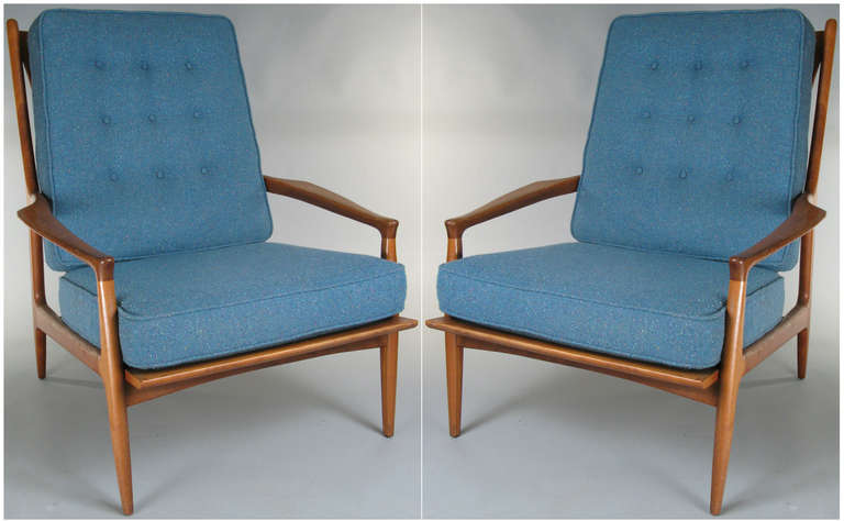 a beautiful and very comfortable pair of 1950's Lounge Chairs designed by Milo Baughman for Thayer Coggin, with sculpted walnut frames and upholstered cushions. signed with original label. the original cushions are slightly different shades of teal.