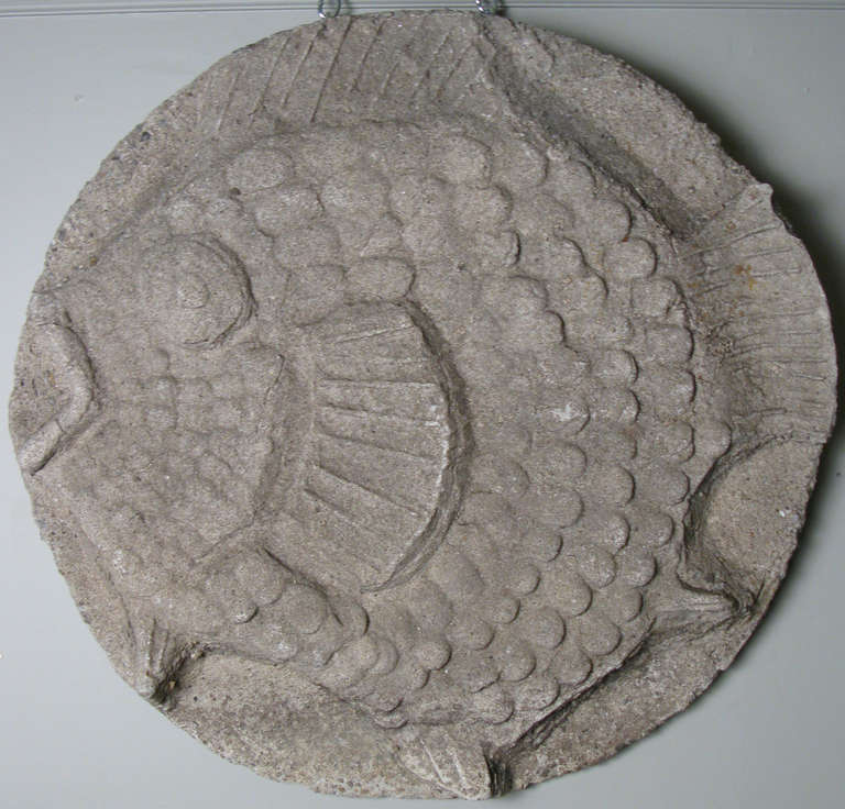a wonderful large cast stone relief of a fin fish, well made with beautiful details. perfect for wall hanging or garden.