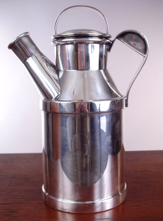 a very handsome antique silver plate pitcher by Reed & Barton. very nice design with an insulated top and mesh strainer in the spout. endgraved 'G'. very good condition.
