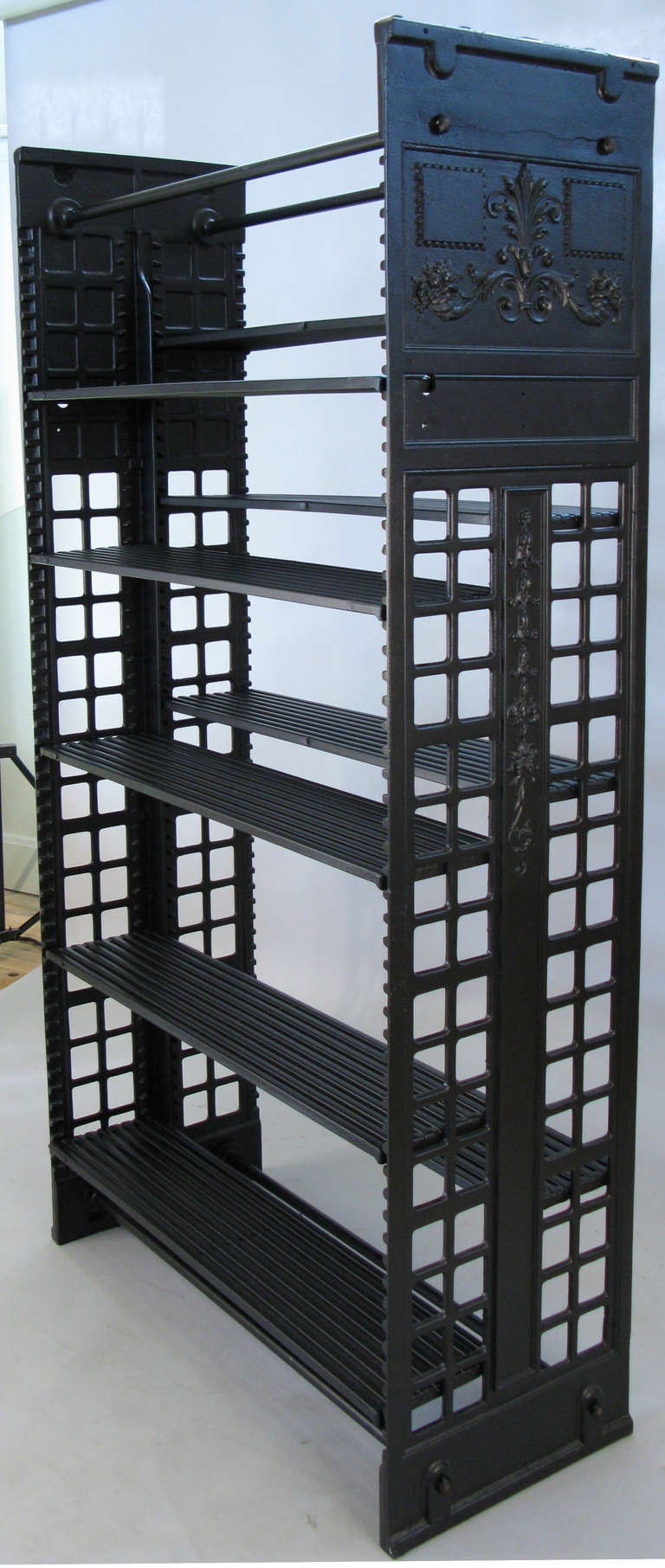 an antique archival library bookcase in cast iron by Snead & Company. beautiful design, powder coated in black. these impressive cast iron bookcases with adjustable steel shelves were the standard in the late 19th and early 20th century for library