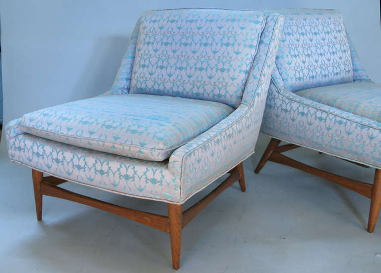 a beautiful pair of vintage 1960's armless slipper lounge chairs with walnut bases. wonderful proportions and extremely comfortable. in original fabric.