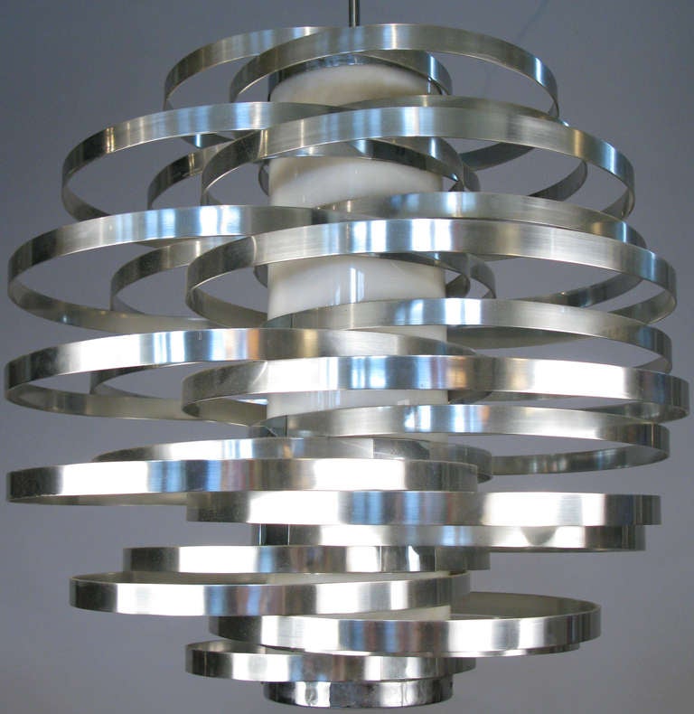 a stunning and dynamic vintage 1970's Italian hanging light designed by Max Sauze for Sciolari. one of his best designs, composed of a series of graduated bands of aluminum, all attached to a central column of light, with the bands placed so that