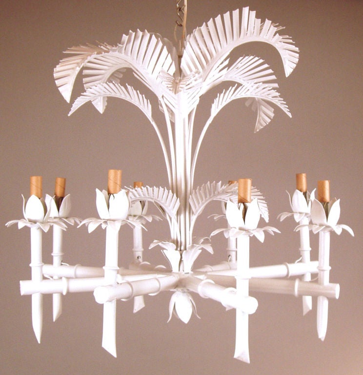 a beautiful vintage 1960's 8 light chandelier with a bamboo motif and highlighted with palm leaves. finished in white lacquer.