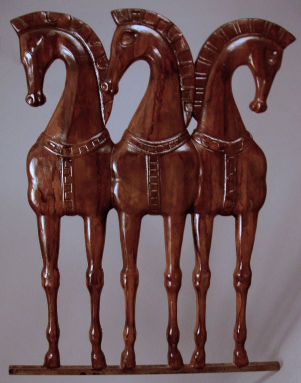 a very engaging vintage 1950's plaster wall hanging sculpture by Frederick Weinberg. Three etruscan horses stand alongside one another. mounted on a steel bar.