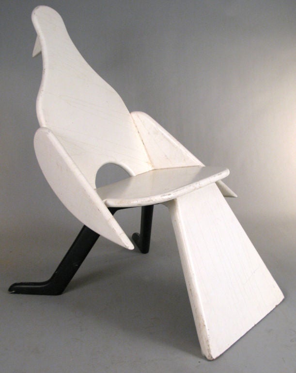 a charming occasional chair in the form of a standing bird, after Francois-Xavier Lalanne. wonderful form and execution in white and black lacquered wood. heavy and very well made.