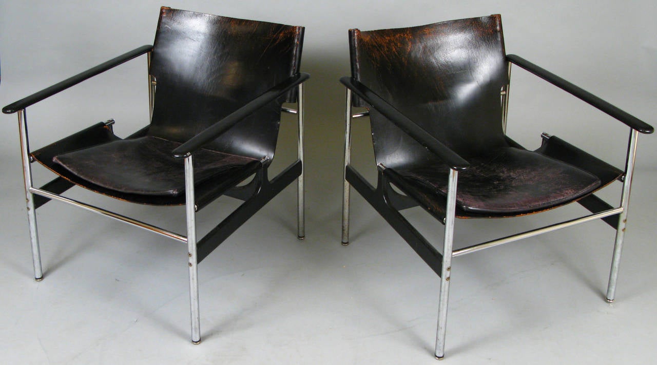 a very handsome pair of classic modern chrome frame and leather lounge chairs designed by Charles Pollack for Knoll. one of the most well designed mid-century lounge chairs, these Pollack chairs have a leather sling seat which makes them extremely