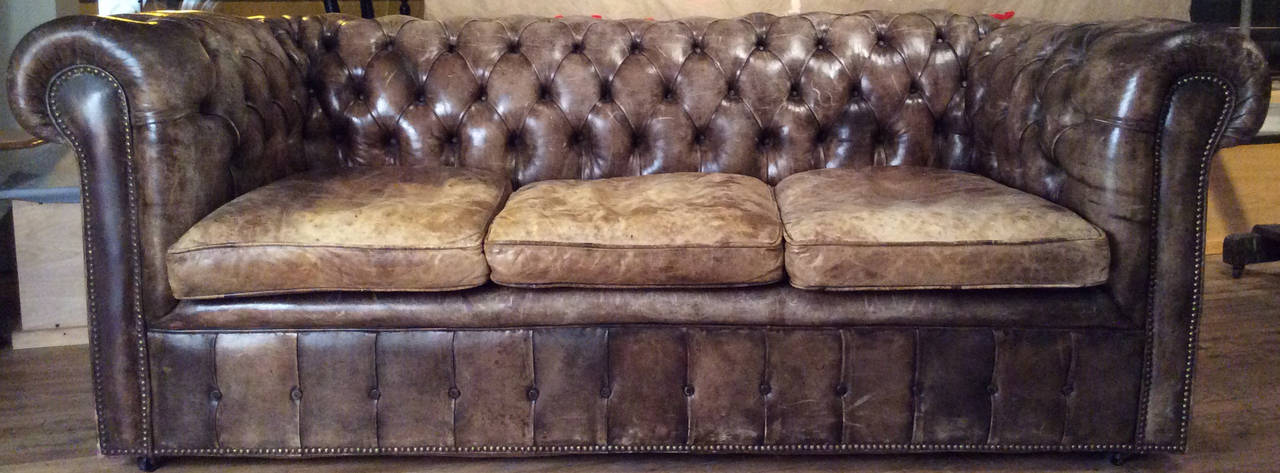 a classic and beautiful vintage leather chesterfield sofa, in chestnut brown. wonderful color and patina.