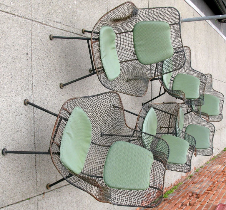 a great set of vintage Sculptura Chairs & Matching table in steel mesh designed by Russell Woodard. this set includes 4 low back armchairs and 2 highback armchairs, as well as the classic octagonal matching table. the entire set of chairs also
