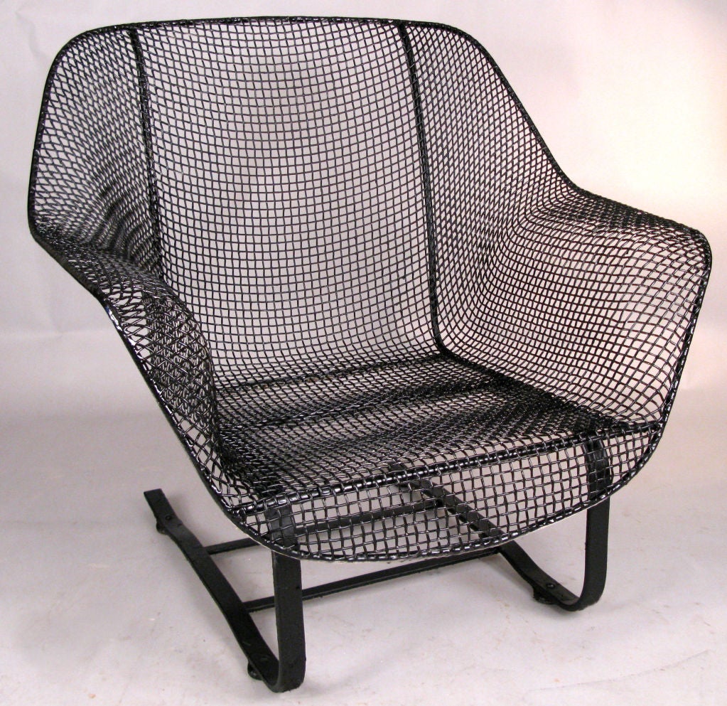 the most comfortable of Russell Woodard's classic and iconic 'Sculptura' collection, the spring lounge chair is formed entirely of woven steel mesh, mounted on a spring base of wrought iron. wonderful form and extremely comfortable and relaxing.