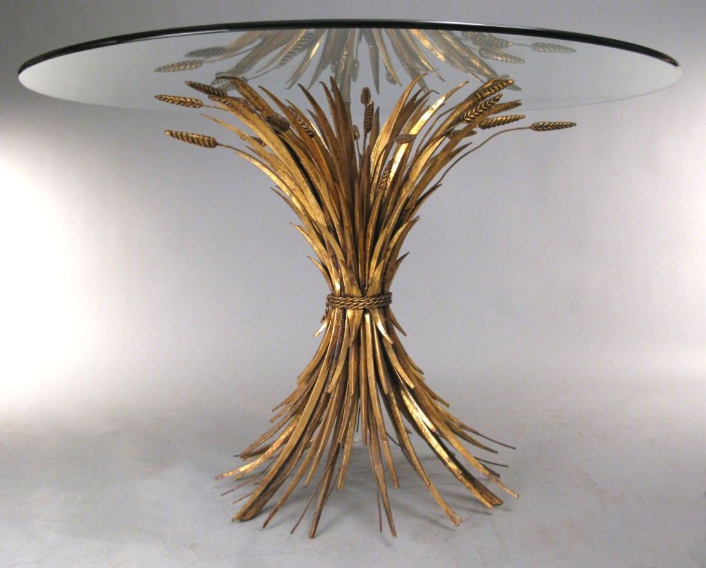 a classic and beautiful Italian mid-century hollywood regency gilt gold sheaf of wheat dining table with round glass top. very good condition. <br />
<br />
also available are the set of 4 Italian gilt wheat chairs in a separate listing.