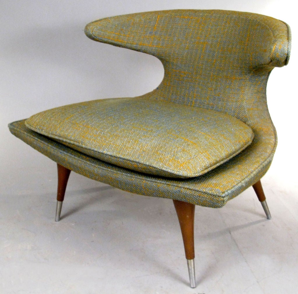 a fantastic mid-century lounge chair designed by Karpen of California - well known for several of the 1950's most exciting chair designs, the 'horn' lounge chair is the best and most iconic. a low & wide sclupted seat curves into the back which