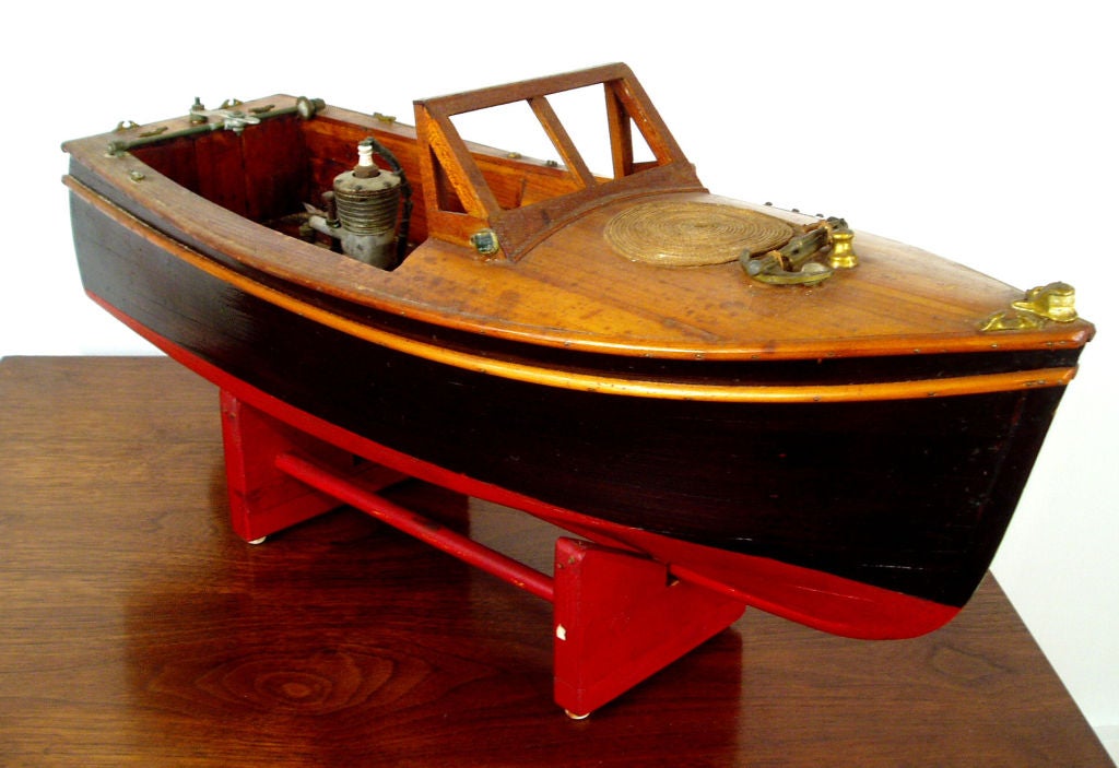 an antique handcrafted runabout boat model, with original mechanical components, in original condition with beautiful patina, purchased from it's creator Edward Waldron of Little Compton, RI