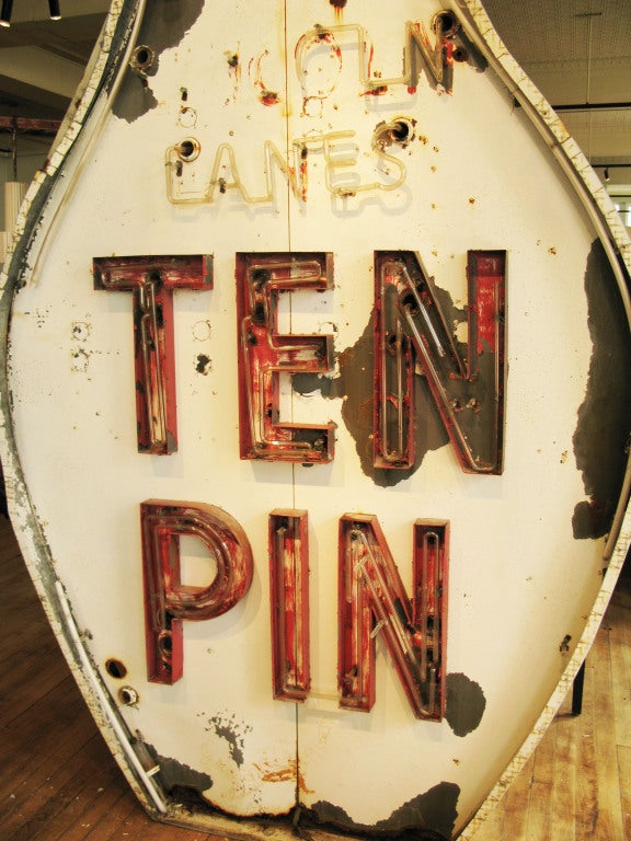 an amaizng 11 foot tall steel sign from the roof of a 1950's era bowling lanes, in the shape of a bowling pin, with 'ten pin' in raised red lettering, and the remnants of additional neon on the sign. double sided with ten pin on both sides.