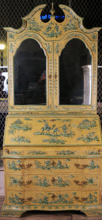 a beautiful tall vintage Italian Chinoiserie secretary. the base has 3 drawers, and the stepped back upper case has a drop front desk, and a pair of mirrored doors concealing an interior fitted with cubbies and drawers. the whole finished in yellow
