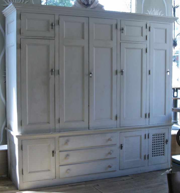 an amazing custom designed freestanding closet entirely lined in natural cedar, with 3 sections of varying heights with hanging rods, a compartment with built-in shoe racks, and many additional spaces and drawers.