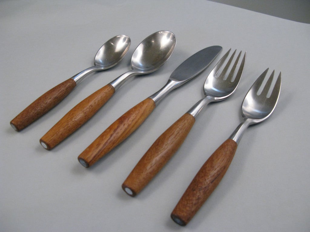 a large set of vintage Fjord flatware designed by Jens Quistgaard for Dansk and made in Germany. This large set includes twelve 5 piece place settings: dinner & soup spoon, salad & dinner fork, and dinner knife. Also included with this set are the