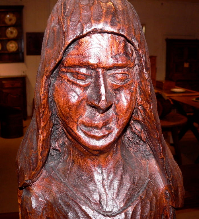 Originating from mid 19th Century Burgundy, this interesting figure is quite primitive and probably was carved on the farm. These types of figures were usually of a religious nature but again possibly it is of a peasant women. The wood base is new.
