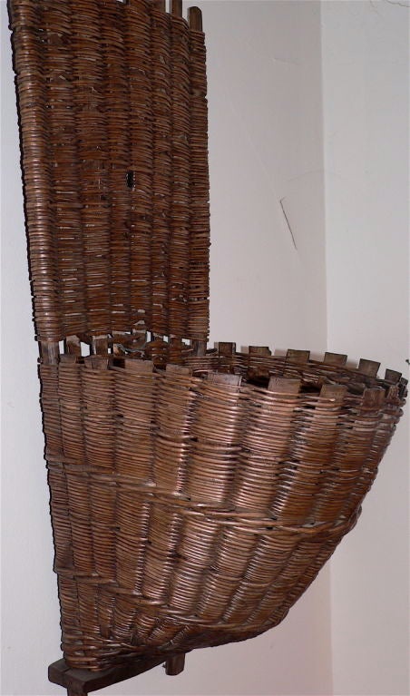 This type of grape gathering basket is from the Champagne region and has a very tight weave. It is solid and in very good condition