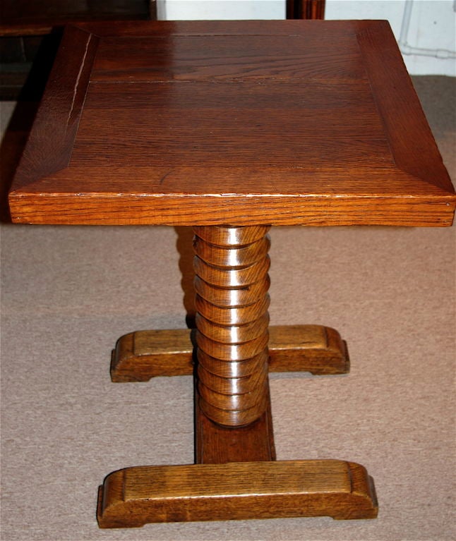 This table originates from the Normandy region and was probably from a hotel. The table has wine press screw motif on its stem with two sleigh feet. All of solid oak.
