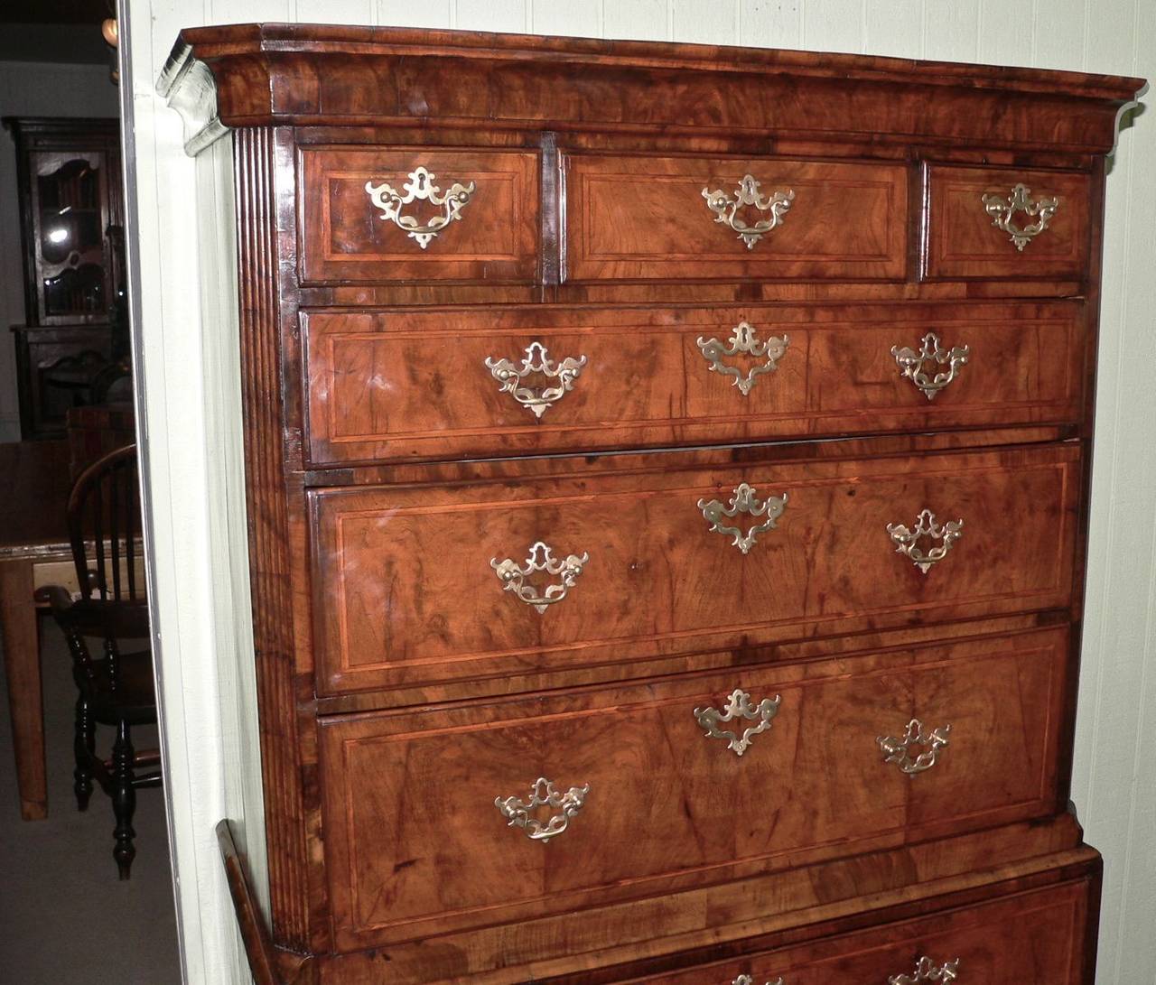 This very pretty chest dates from about 1745 and has both crossbanding and feather banding on the drawers along with fluted canted corners. The drawers are oak lined. Great original color and patina to the walnut.