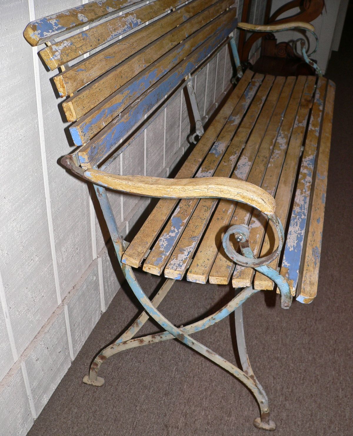 This very attractive early 20th Century slated bench has the original Provencal yellow and blue colors. It is sturdy and will fold as seen in image 3. It is great condition although I imagine it should be utilized in a covered environment.