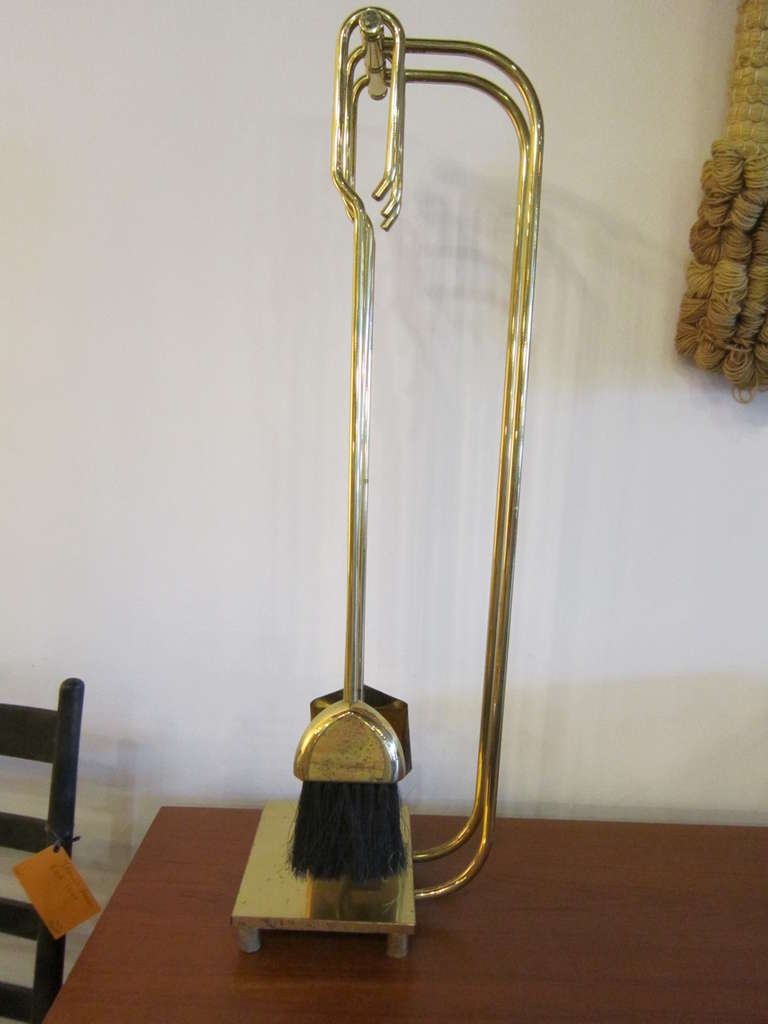 High styled solid brass fireplace tools.