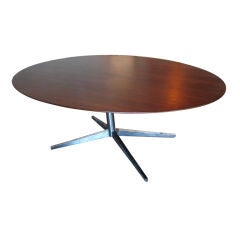 Rosewood elliptical table by Florence Knoll