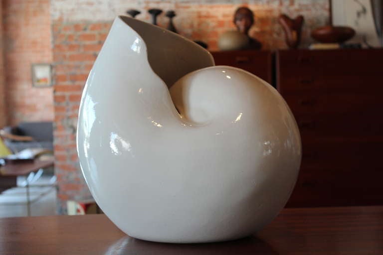 A large ceramic shell vase sculpture marked 