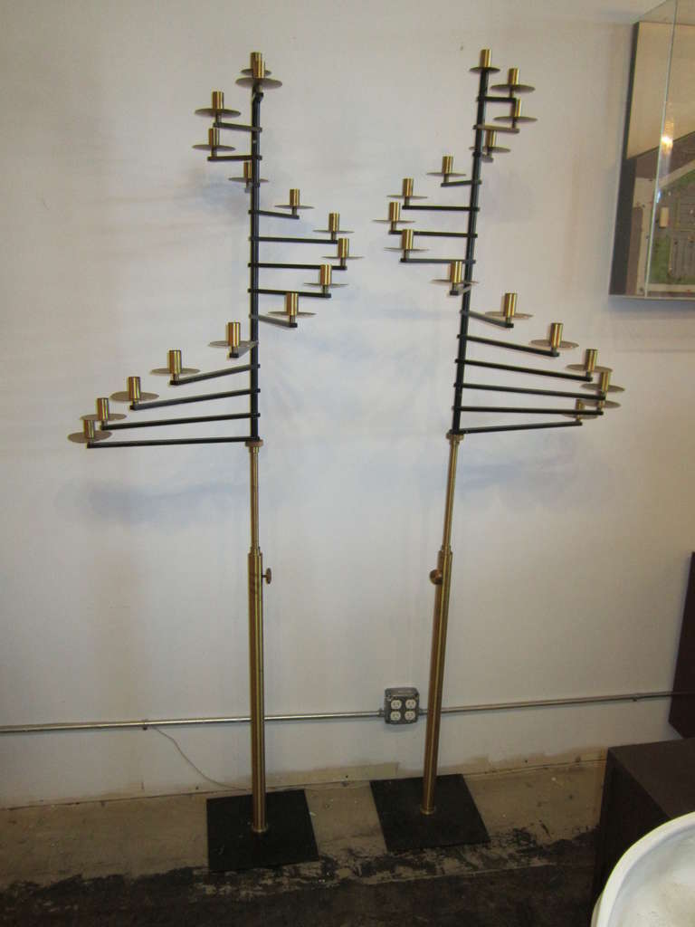 Exquisite pair of standing candelabras. They are adjustable in height from 6' to 7.5'.