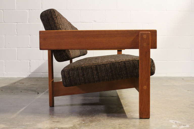A very architectural sofa made of solid oak by Harter.