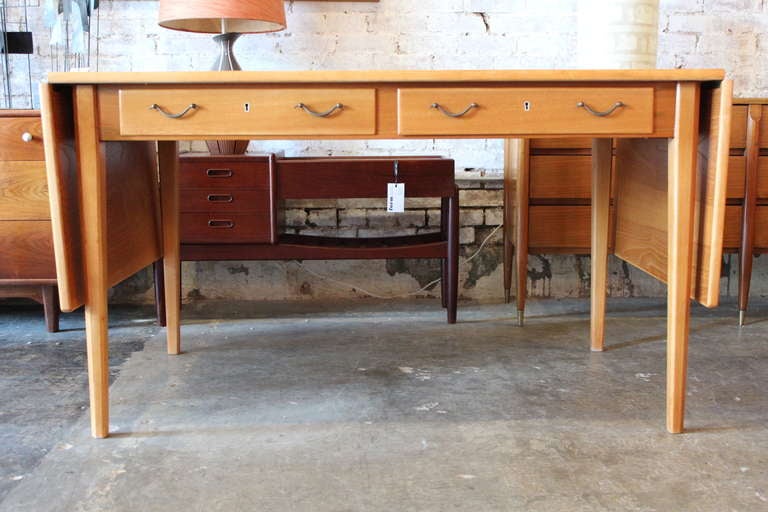 A Swedish drop leaf desk that also functions as a dining table. The table extends to 87
