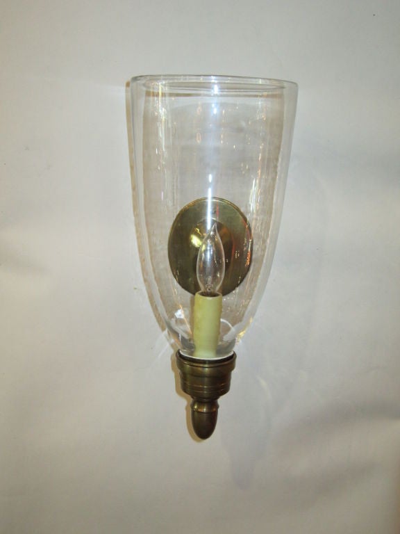 Electrified brass candle sconces. The glass hurricane shade encloses a bees wax electrified candle. 
If you have any questions about this item or about shipping, please contact dealer.