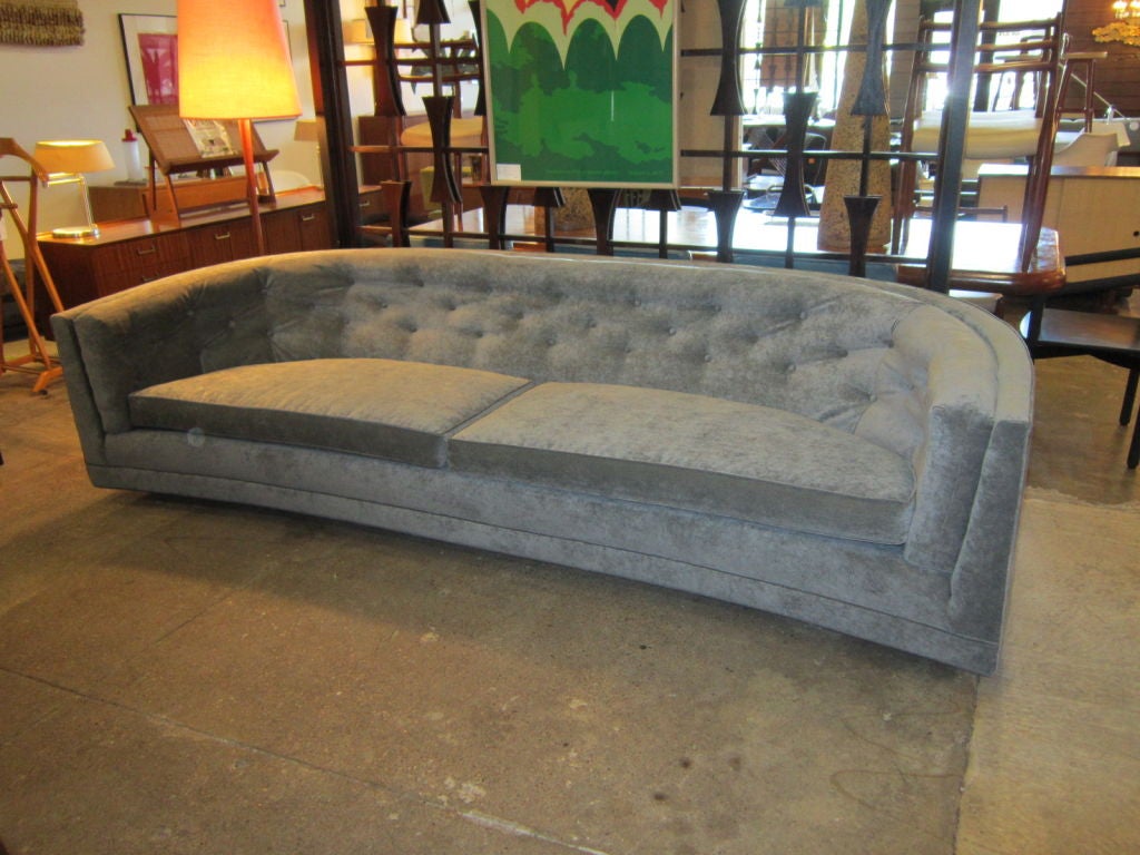 Nice large scale 1960's sofa with curved ends. Reupholstered in a blue-grey velour.