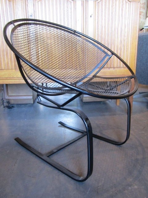 A very comfortable pair of rocking slapper chairs by Salterini with new black powdercoat.