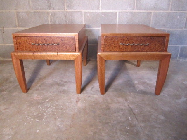 A pair of mahogany end tables with cork drawer fronts and brass pulls. Designed by John Keal for Brown Saltman.  If you have any questions about this item or about shipping, please contact dealer.
